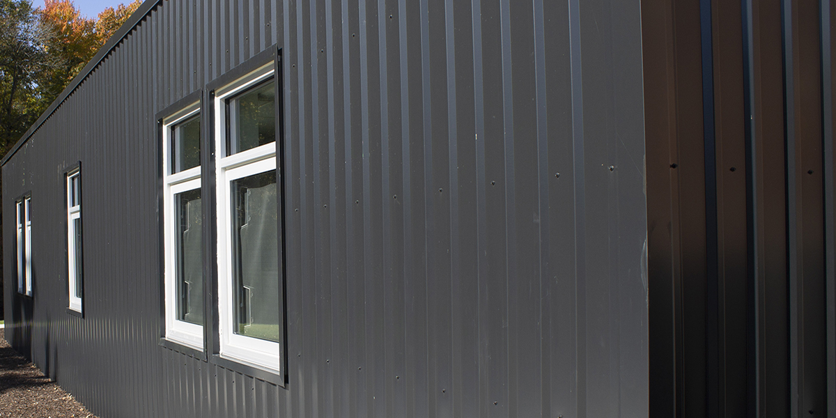 M-Loc metal wall panels on a building exterior with windows