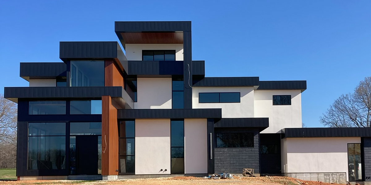 Modern home with dark Precision Loc metal panels