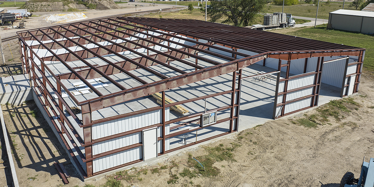 Steel building under construction showing purlins and secondary framing